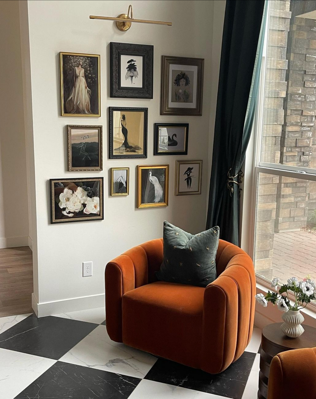 Sophia Jane print in a gallery wall above an orange velvet chair