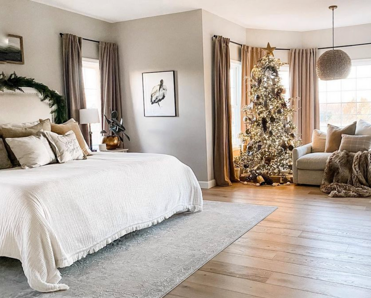 Archibald wood stork print in a bright bedroom with a Christmas tree