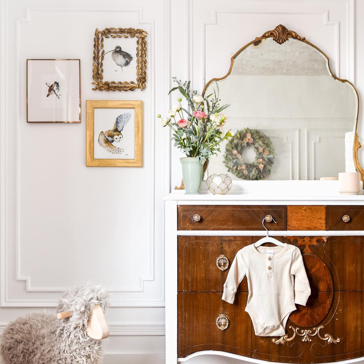 Changing the Game curlew print and two more bird prints in gold frames in a nursery