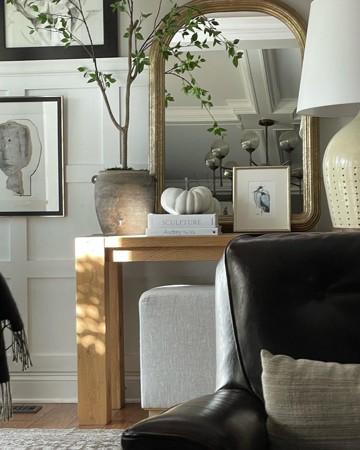 Somewhere heron print in a silver frame on an oak console with an arched mirror