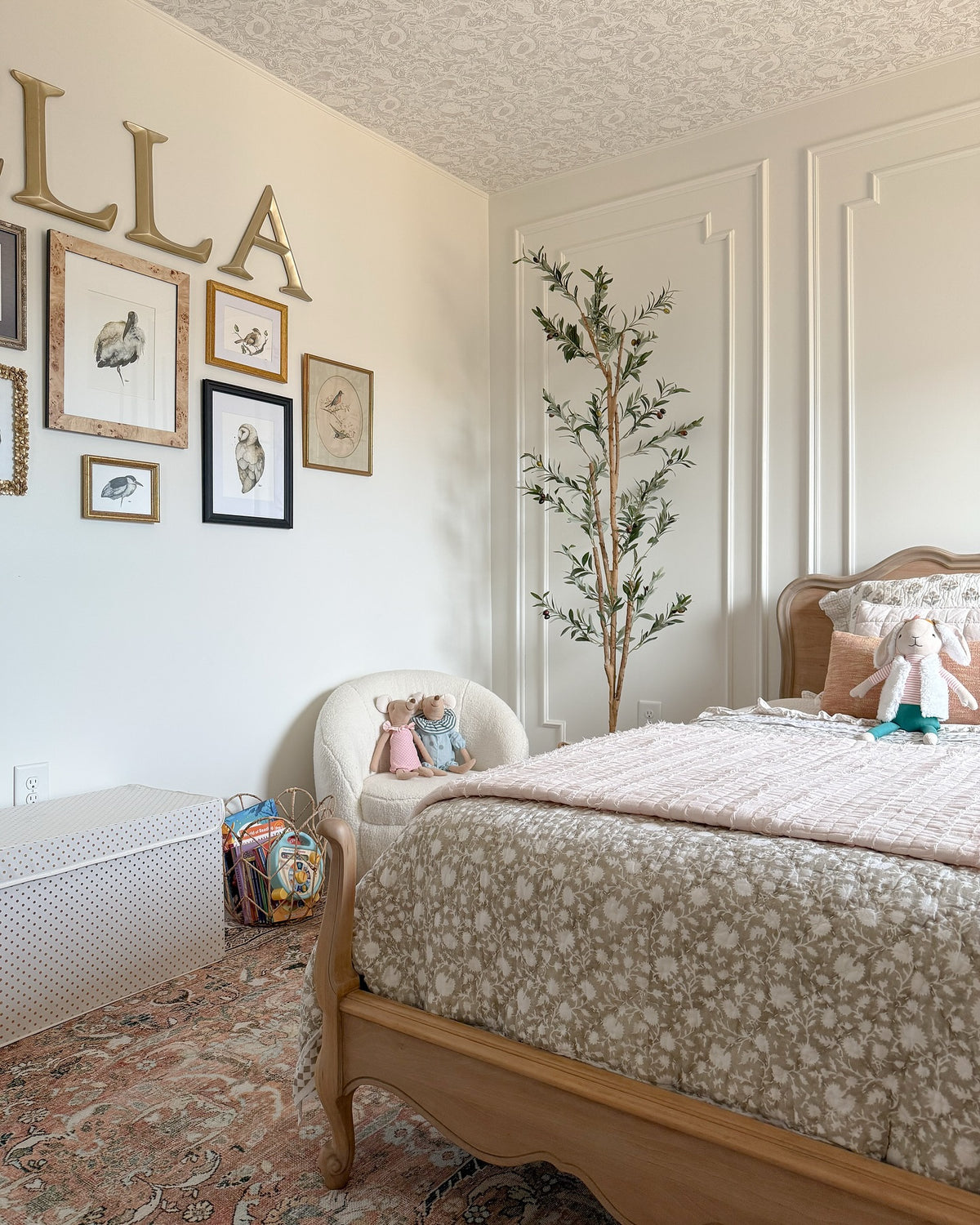 Archibald wood stork print in a burlwood frame with more bird prints in a little girl's room